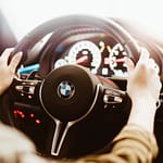 woman driving a bmw luxury car picjumbo com scaled