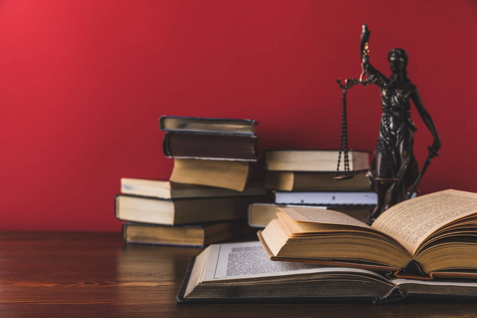 VistaCreate 177306634 stock photo opened juridical books lady justice scaled