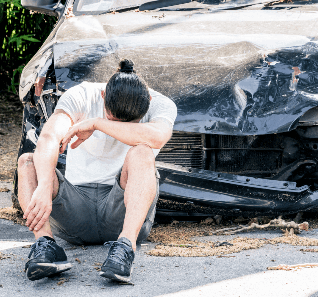 man crying on his old damaged car after crash acci 2021 08 31 04 26 46 utc Personal Injury Lawyer Connection