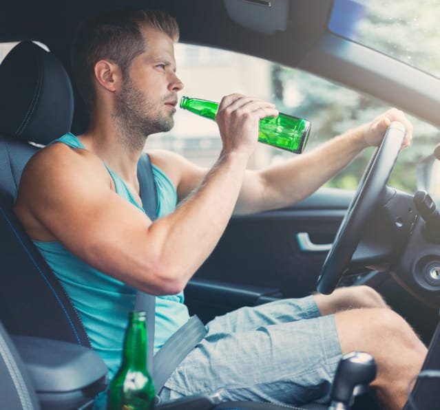 drunk driver behind the steering wheel of a car 2021 08 26 22 39 34 utc